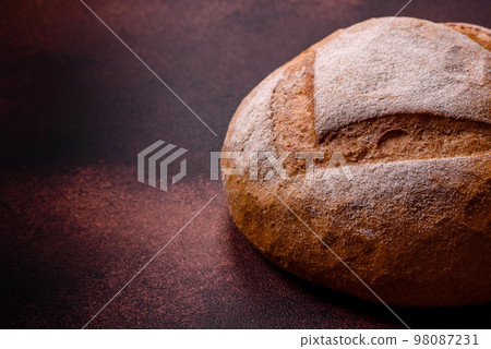 Beautiful delicious freshly baked round shaped white bread Beautiful delicious freshly baked round shaped white bread 98087231