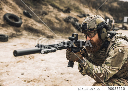 Sniper with rifle on a position Sniper with rifle on a position 98087330