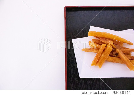 Imokenpi served on a black square plate 98088145