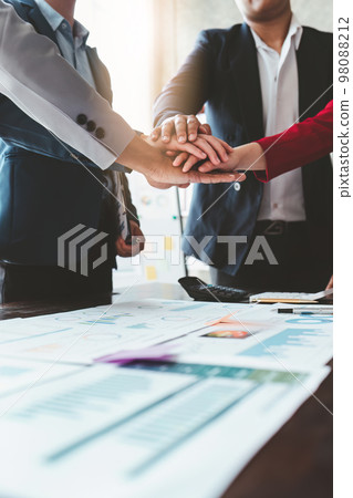 Close up Asian Business people stack of hands working together. Teamwork, Unity, business team concept 98088212