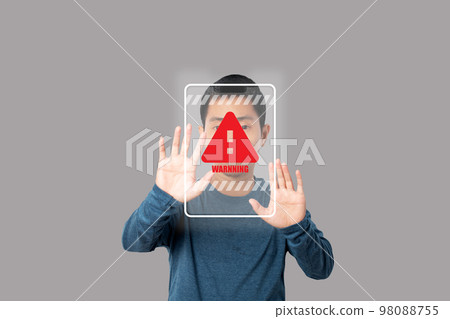 Young man showing stop gesture with warning sign virtual screen. 98088755