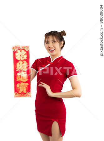 Young Asian woman in red traditional cheongsam dress presenting Chinese new year label isolated white background.. Young Asian woman in red traditional cheongsam dress presenting Chinese new year label isolated white background.. 98089004