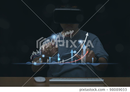 Man wearing VR Headset trading graph financial data, Stock Market Investments analysis and Digital Assets. 98089033