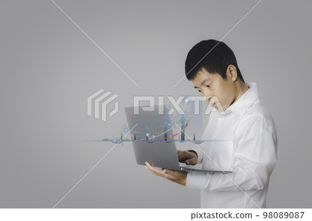 Businessman using laptop computer analysing forex trading graph financial data. Businessman using laptop computer analysing forex trading graph financial data. 98089087