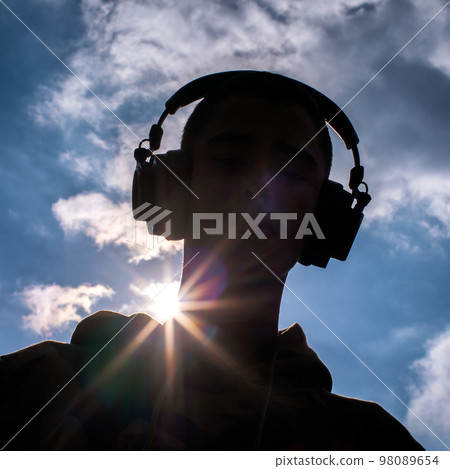 Headphones of head. Black silhouette Headphones of head. Black silhouette 98089654