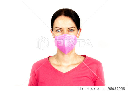 Portrait of woman with pink respirator ffp2 98089968