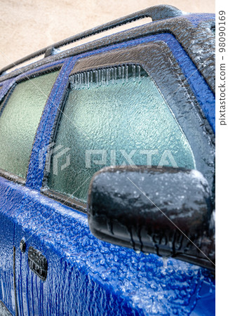 Car covered by icicles from freezing rain 98090169