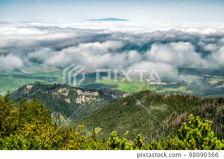 View from top of the hill Sivy vrch in Western Tatras at Slovakia through inversion. Hill Babia Hora at background View from top of the hill Sivy vrch in Western Tatras at Slovakia through inversion. Hill Babia Hora at background 98090366