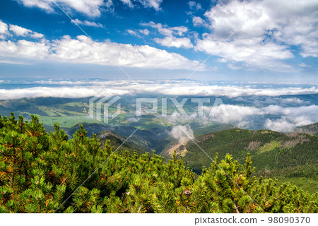 View from top of the hill Sivy vrch in Western Tatras at Slovakia through inversion. Beautiful summer mountain landscape View from top of the hill Sivy vrch in Western Tatras at Slovakia through inversion. Beautiful summer mountain landscape 98090370