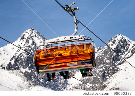 Ski lift and peak Lomnicky stit in High Tatras mountains in resort Tatranska Lomnica, Slovakia 98090382