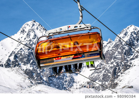 Ski lift and peak Lomnicky stit in High Tatras mountains in resort Tatranska Lomnica, Slovakia 98090384