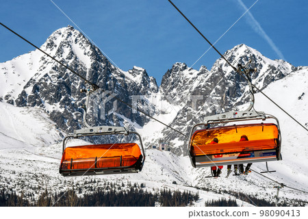 Ski lift and peak Lomnicky stit in High Tatras mountains in resort Tatranska Lomnica, Slovakia 98090413