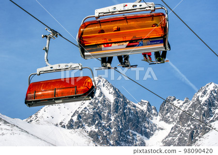 Ski lift and peak Lomnicky stit in High Tatras mountains in resort Tatranska Lomnica, Slovakia 98090420