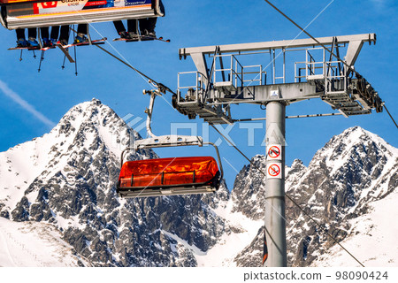Ski lift and peak Lomnicky stit in High Tatras mountains in resort Tatranska Lomnica, Slovakia 98090424