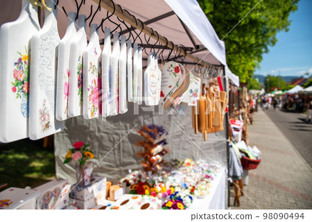 Wood products of seller at market fair 98090494