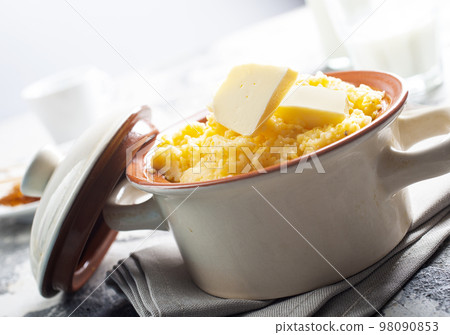 porridge with butter in plate on rustic table porridge with butter in plate on rustic table 98090853