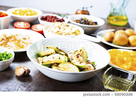 Hot stir fried vegetables on plates Hot stir fried vegetables on plates 98090886