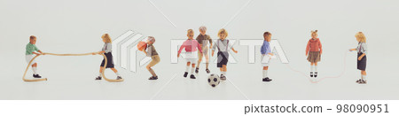 Horizontal banner with images of happy children in retro style clothes playing together, having fun isolated over grey background. Football, basketball, ropes 98090951