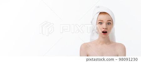 Surprised Beautiful Young Woman After Bath with A Towel On Her Head Isolated On white Background. Skin Care And Spa Theme. Surprised Beautiful Young Woman After Bath with A Towel On Her Head Isolated On white Background. Skin Care And Spa Theme. 98091230