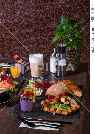 Breakfast or brunch set for two person on rustic wooden table 98091306