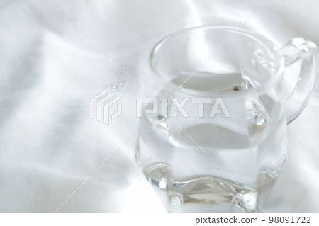 Water in a transparent glass, white background, blank space, simple, clear water, beautiful Water in a transparent glass, white background, blank space, simple, clear water, beautiful 98091722
