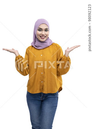 Asian Muslim woman in a headscarf with an open palm showing something 98092123