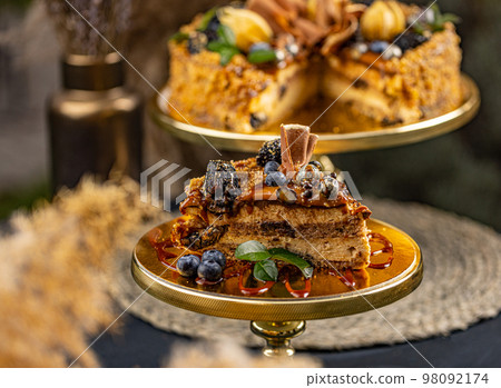 Cake topped with salted caramel. Cake topped with salted caramel. 98092174