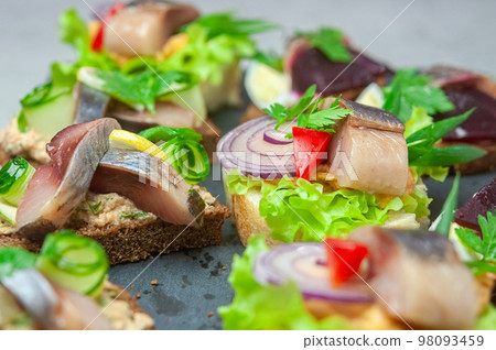 Appetizer with salted herring. Appetizer with salted herring. 98093459