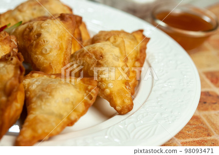Wontons. Fried dumplings. Wontons. Fried dumplings. 98093471
