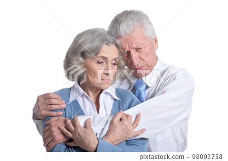sad senior couple posing isolated on white background 98093758