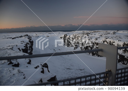 Continental Bridge, a bridge connecting Europe and North America at dawn in winter on the Reykjanes Peninsula, Iceland 98094139
