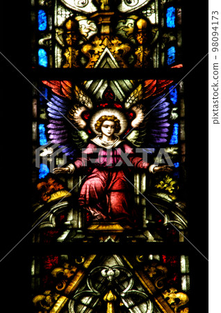 Stained glass window detail with Biblical scene Stained glass window detail with Biblical scene 98094173