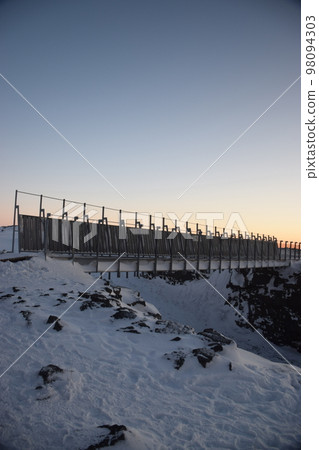 Continental Bridge, a bridge connecting Europe and North America at dawn in winter on the Reykjanes Peninsula, Iceland 98094303