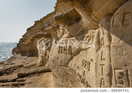 Carved and engraved names in the rock 98094741