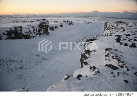 Iceland, Reykjanes Peninsula, Europe and North America at dawn in winter Iceland, Reykjanes Peninsula, Europe and North America at dawn in winter 98094984