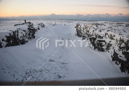 Iceland, Reykjanes Peninsula, Europe and North America at dawn in winter Iceland, Reykjanes Peninsula, Europe and North America at dawn in winter 98094988