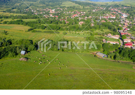Flying over a village in Transylvania, Romania by drone Flying over a village in Transylvania, Romania by drone 98095148
