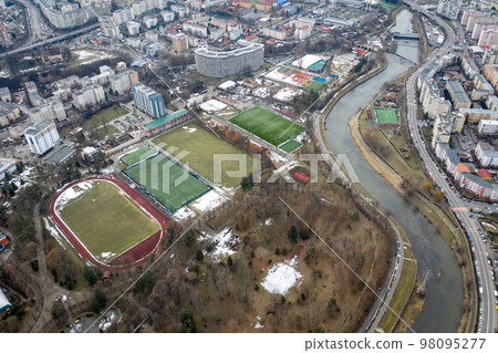 Aerial above view of river crossing the city 98095277