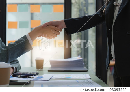 Business people handshake with business partners. Successful business concept. shaking hand after deal concept Business people handshake with business partners. Successful business concept. shaking hand after deal concept 98095321