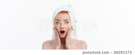 Surprised Beautiful Young Woman After Bath with A Towel On Her Head Isolated On white Background. Skin Care And Spa Theme. 98095373