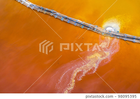 Aerial image of red polluted mining water residuals Aerial image of red polluted mining water residuals 98095395