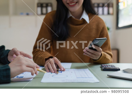 Asian business advisor meeting to discuss and analyze and the situation on the financial report in the meeting room. Fund Investment and accounting concept 98095508