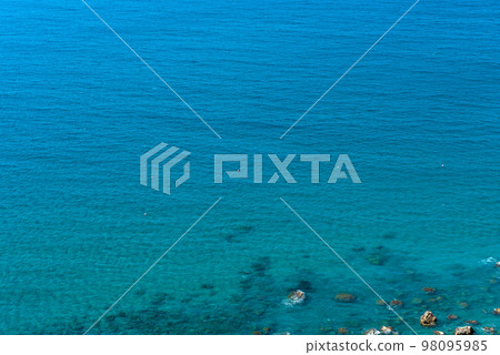 Sea and coastline view from a rocky height Sea and coastline view from a rocky height 98095985
