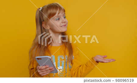 Child girl kid using smartphone show thumbs up like, positive feedback recommends wifi connection 5G 98096519