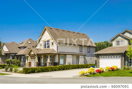 Big family house with concrete driveway to the garage 98097091