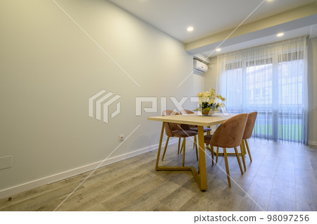 Large beige and cream luxury kitchen interior with empty wall 98097256