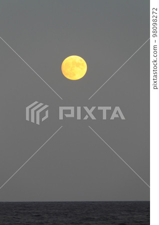 full moon rising to the coast 98098272