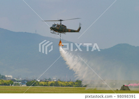 Ground Self-Defense Force helicopter during firefighting training Ground Self-Defense Force helicopter during firefighting training 98098391