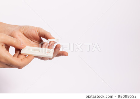 Finger with a cotton swab after blood test for hiv. On a white background with a copy space. 98099552