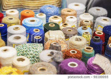 Set of bobbins with yarn for knitting, colorful threads. Sale of goods for creativity and needlework. Hobby 98100093